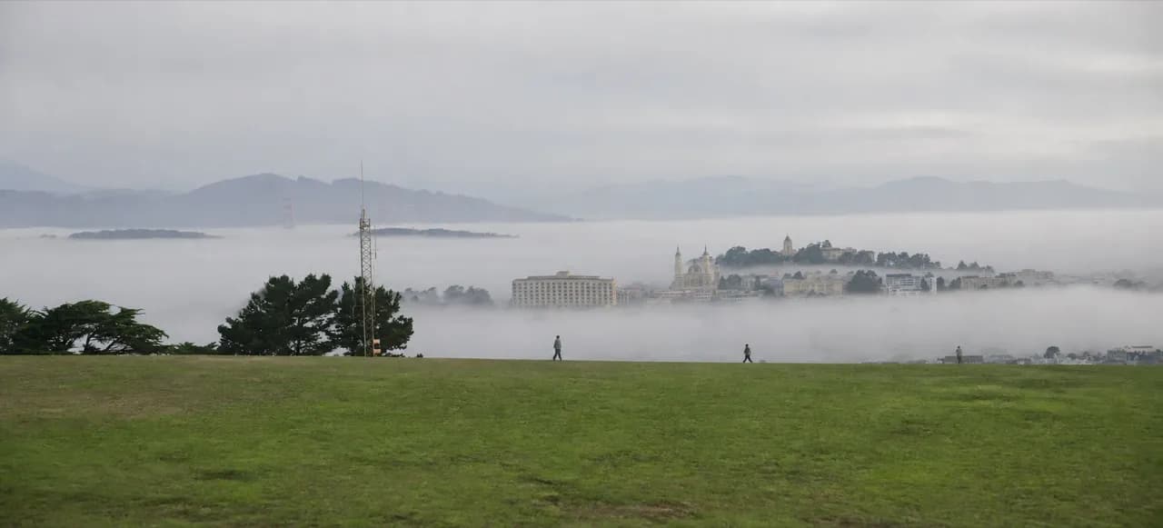 Fog moving across an open San Francisco hilltop