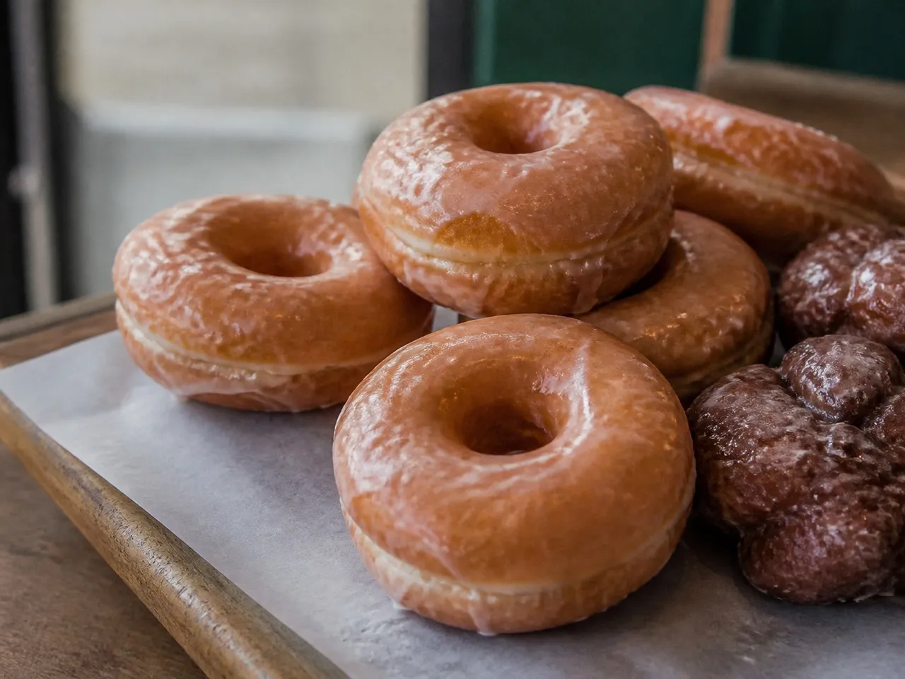Glazed donuts and pastries in a bakery case