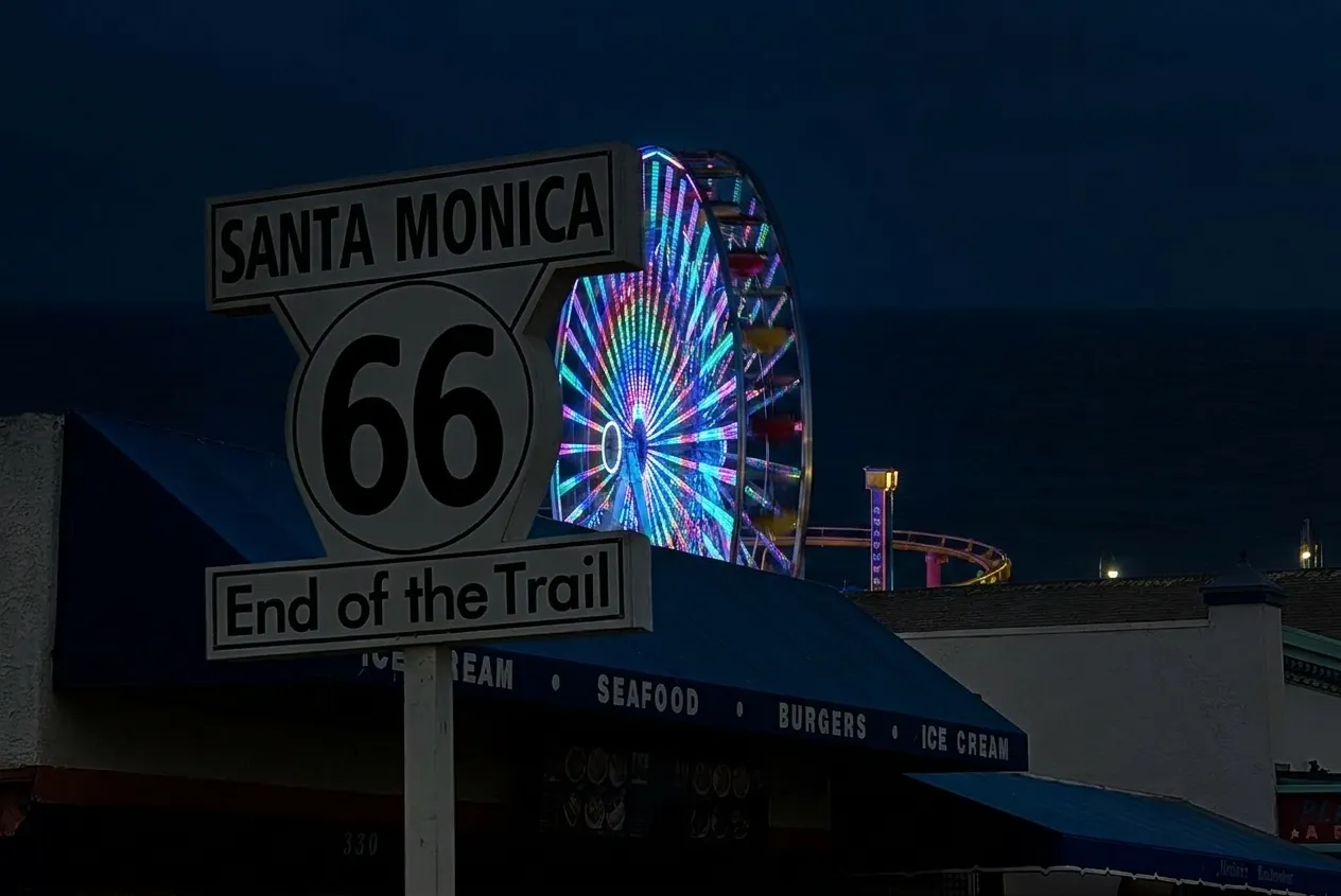 Pacific Wheel solar-powered Ferris wheel lit with LED patterns against dark ocean sky