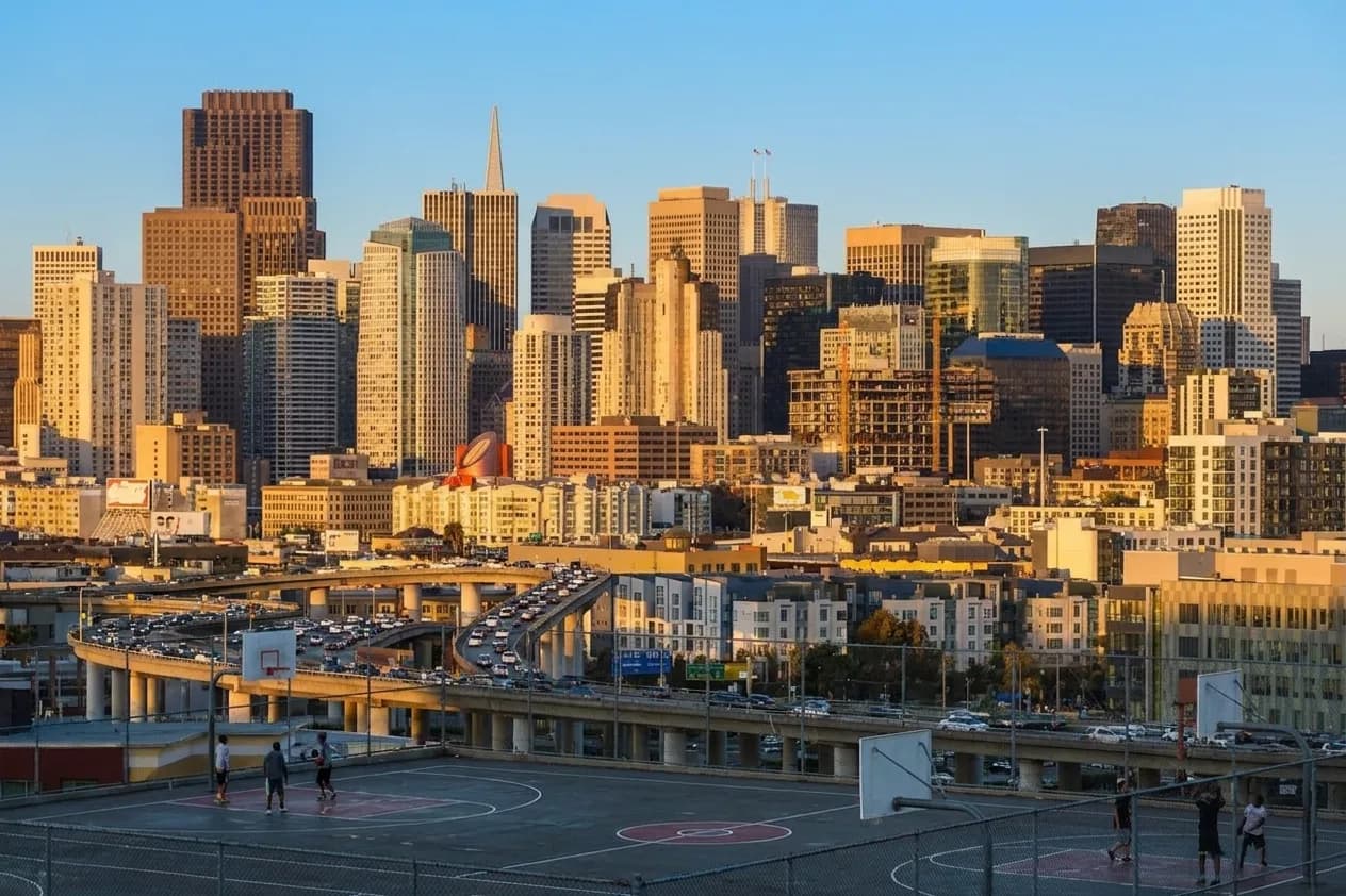 View of downtown San Francisco skyline from Potrero Hill Recreation Center with outdoor basketball courts in the foreground