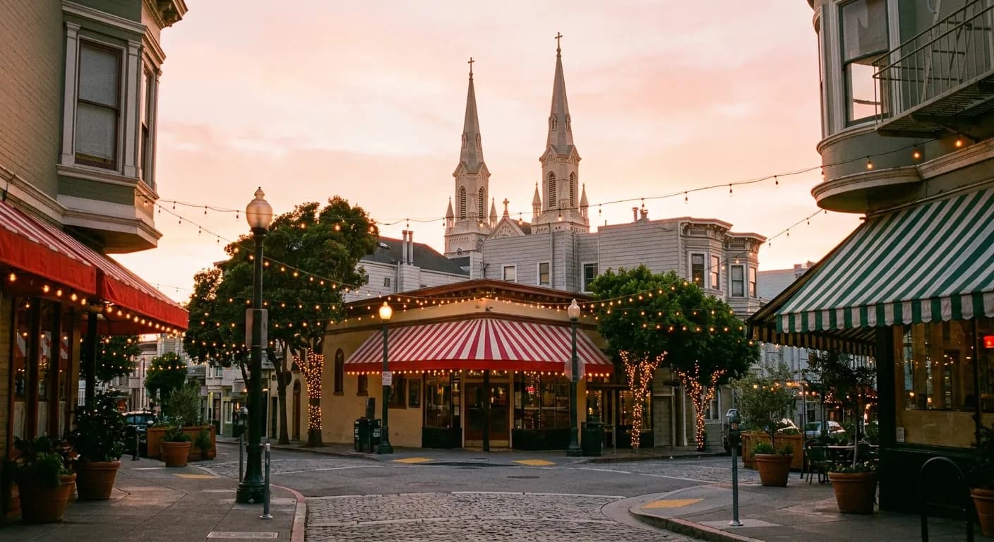 Evening light on a North Beach street corner with cafe awnings and a church spire beyond