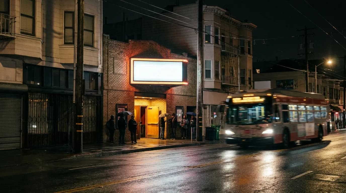 A narrow brick-fronted music hall on upper Mission Street in San Francisco, neon sign glowing over the sidewalk at night.