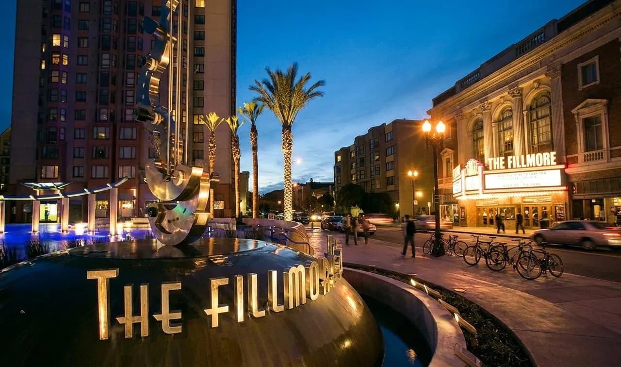 The Fillmore marquee glowing at night on a San Francisco block