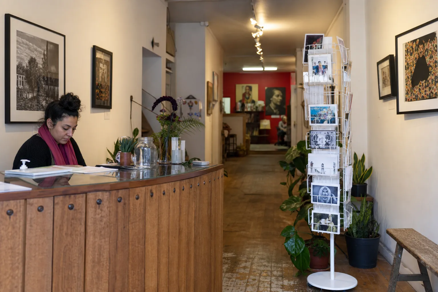 Small Mission arts space interior with gallery displays and a quiet counter