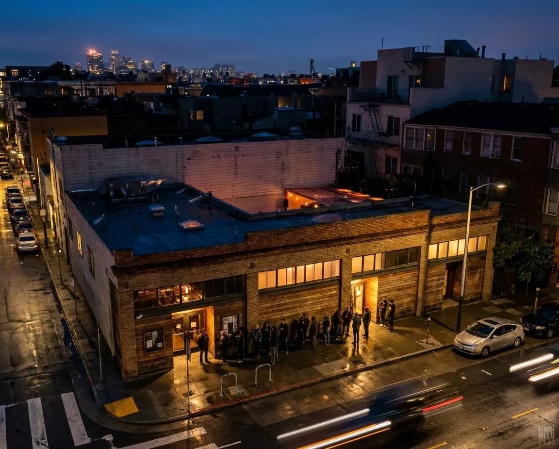 A small San Francisco live music venue exterior at dusk with a short line outside