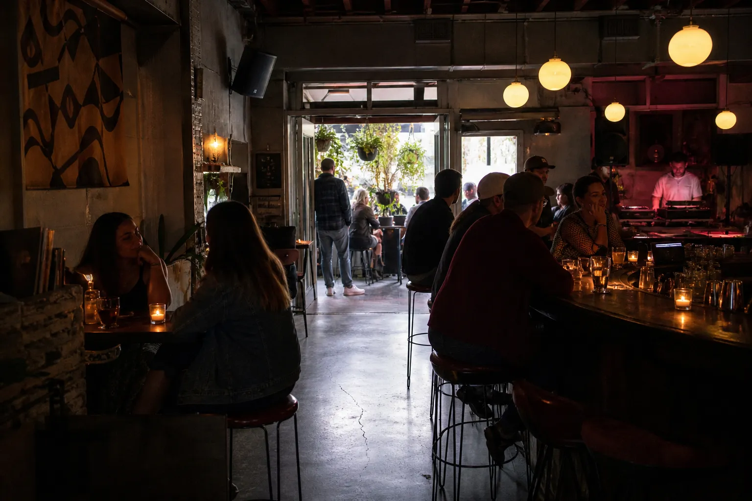Night street outside Silver Lake bars with rideshare drop-off and glowing patios