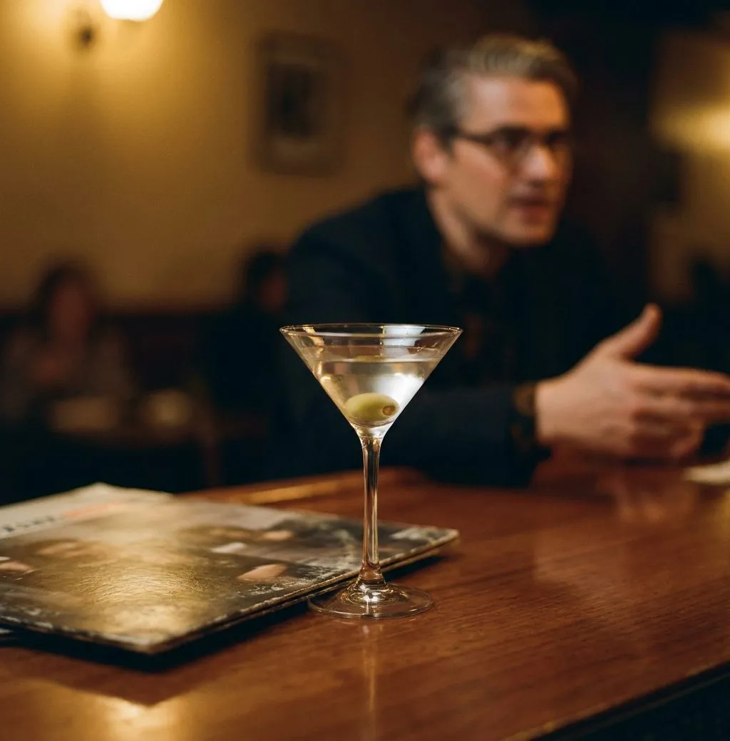 Stools at Mace's where the bartender builds martinis in sequence without speaking and the vinyl plays low