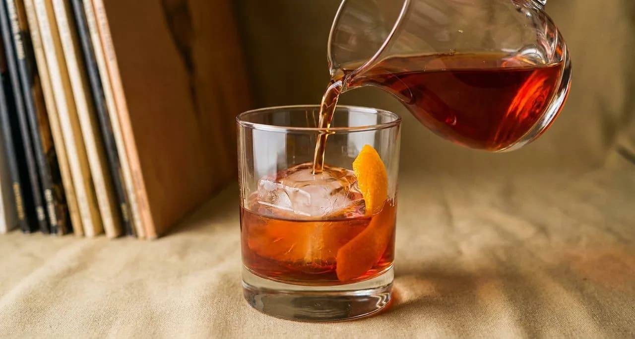 Stools at Slowly Shirley where the record collection lines the walls and the Negroni is batched daily