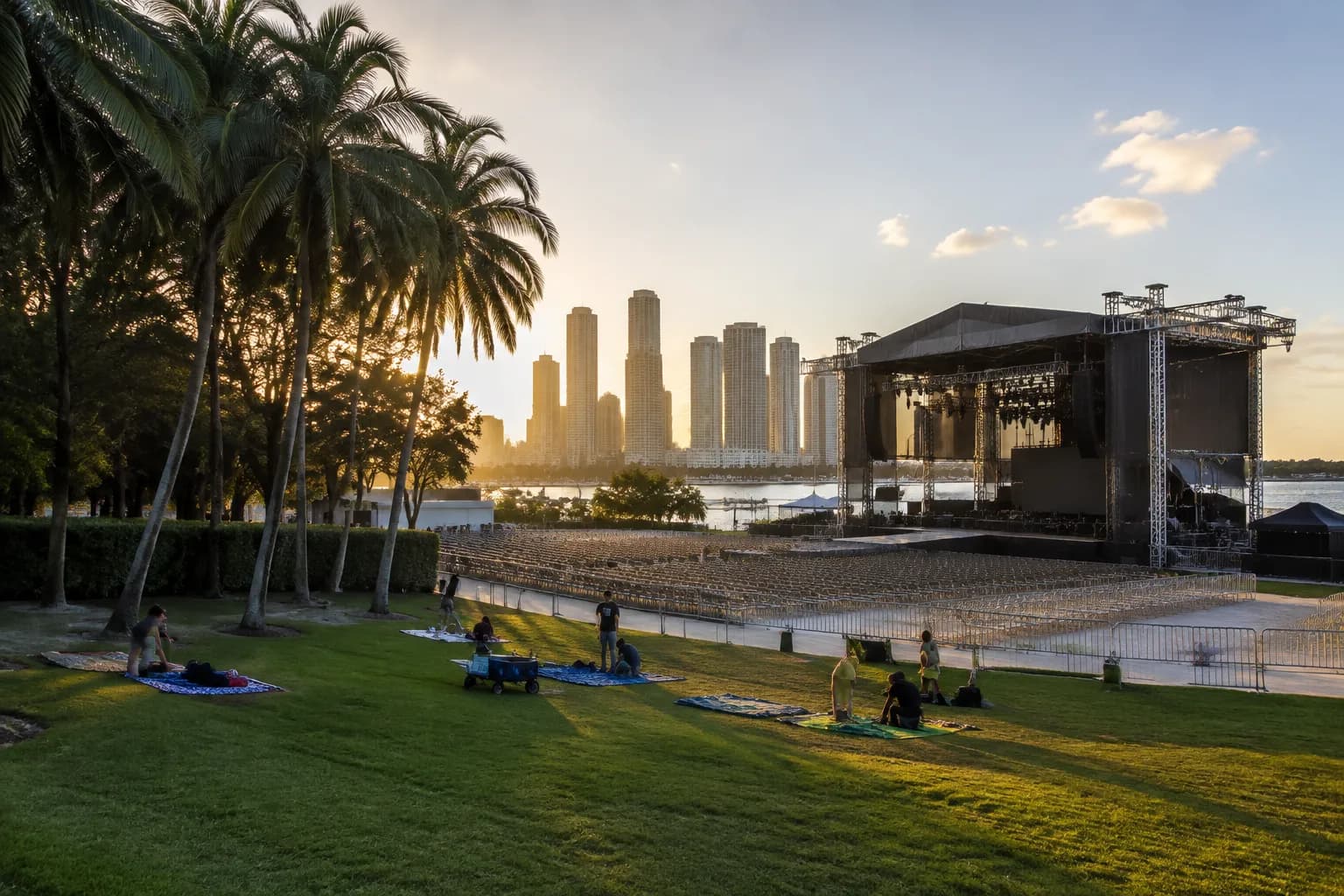 Bayfront Park amphitheater at dusk with downtown Miami skyline in the background before a summer concert