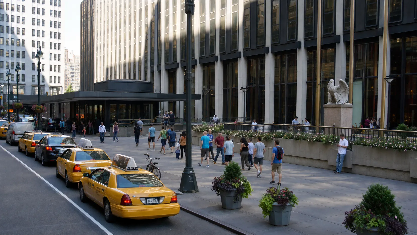 Daytime exterior view of Madison Square Garden in Midtown Manhattan with pedestrians nearby.