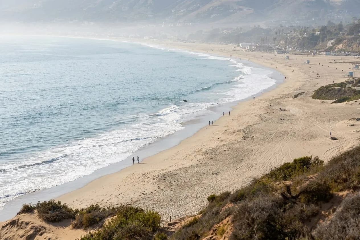 Wide open sand and shoreline at Zuma Beach in Malibu