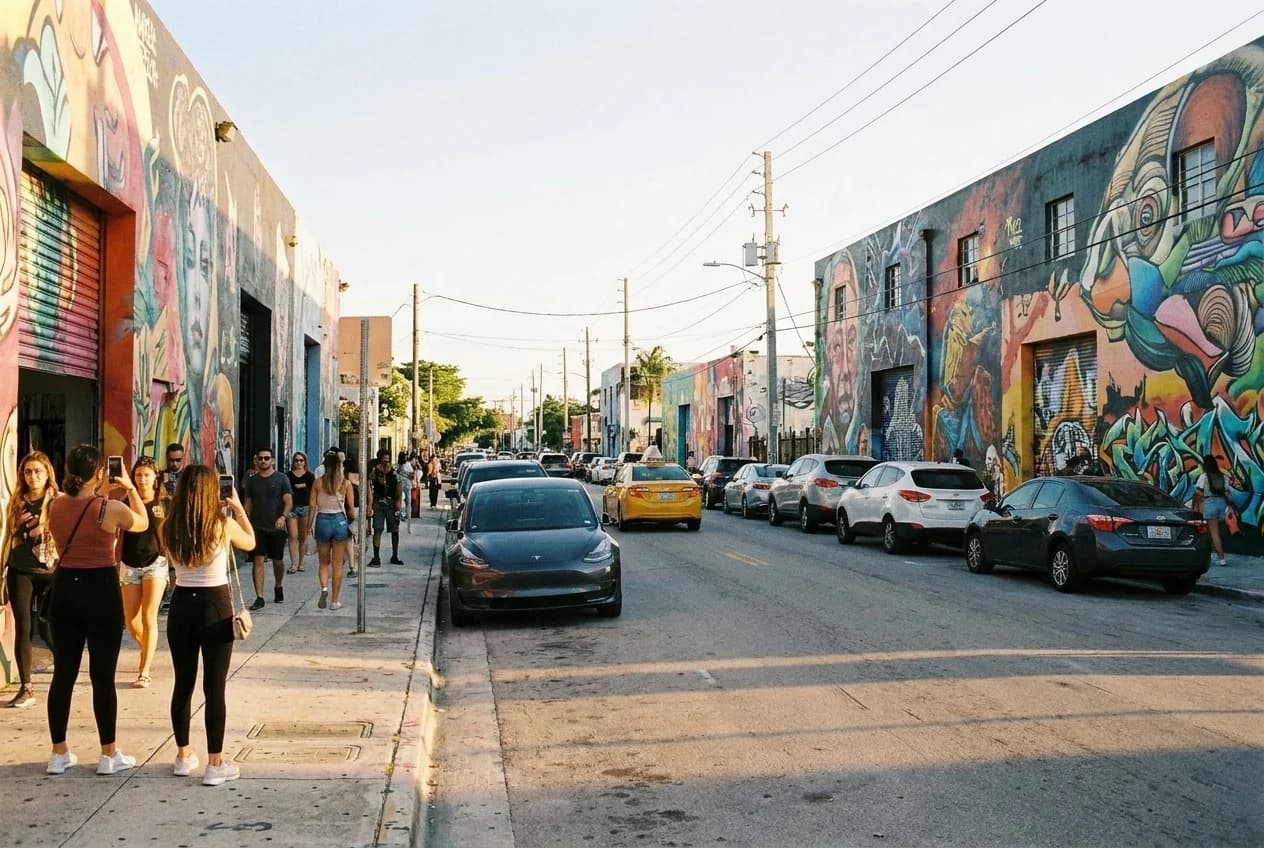 NW 2nd Avenue in Wynwood with mural-covered warehouse walls and wide sidewalks