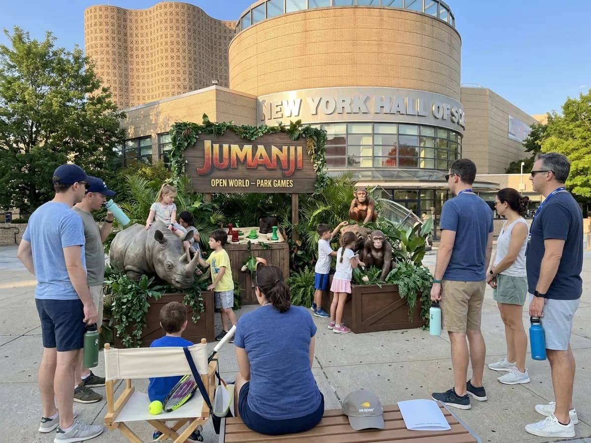 A bright Queens local-life scene connected to Jumanji Open World Park Games Around US Open Breaks.