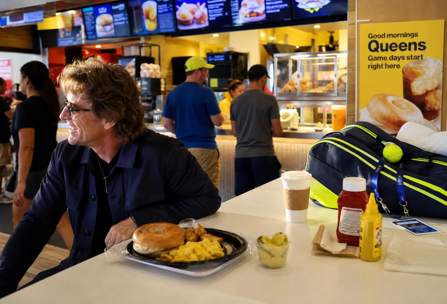 A bright Queens local-life scene connected to Boston Rock Frontman Jeff Conolly Near US Open 2026: Queens Breakfast Counters Before Day Sessions.