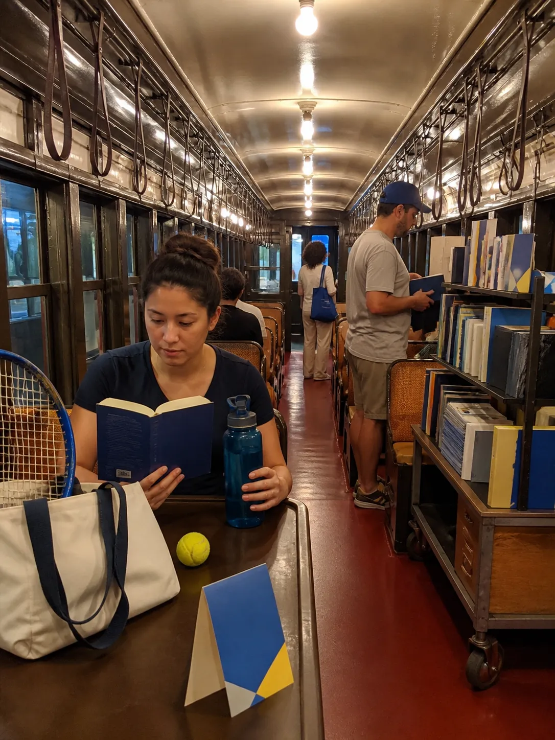 A bright Queens local-life scene connected to Dario Amodei AI Ethics Bookstores Near Queens US Open.