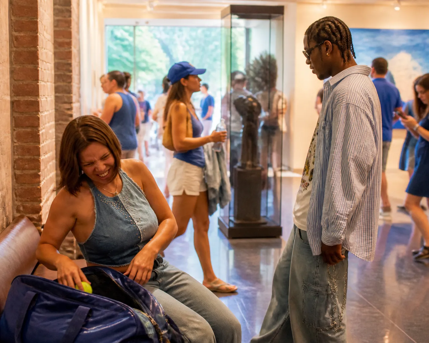 A bright Queens local-life scene connected to Asap Rocky Near US Open 2026: Museum Air-Conditioning Breaks Between Sessions.