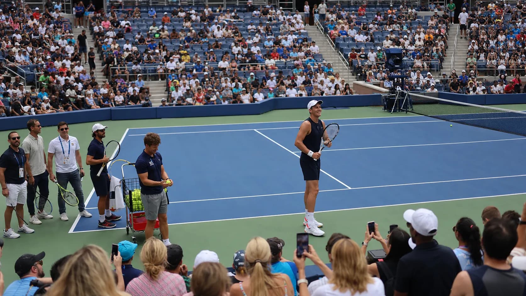 Photorealistic US Open tennis scene for US Open Fan Week 2026: Free Events Worth Planning.