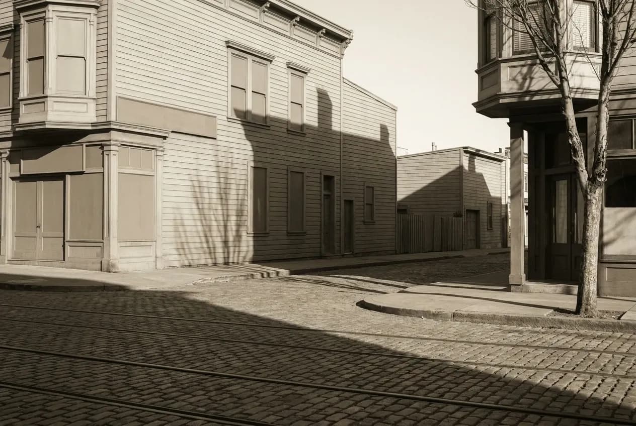 An empty city street in the early morning with long shadows