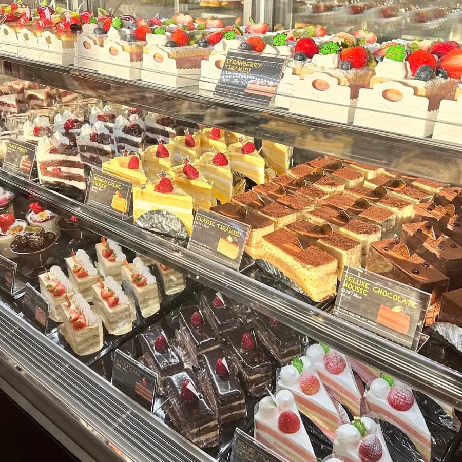 85°C Bakery Cafe: Taiwanese bakery chain — sea-salt coffee, taro bread, full-rotation case