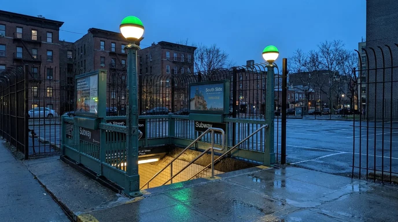 High Street-Brooklyn Bridge subway station entrance in Brooklyn at dusk with green globe lights