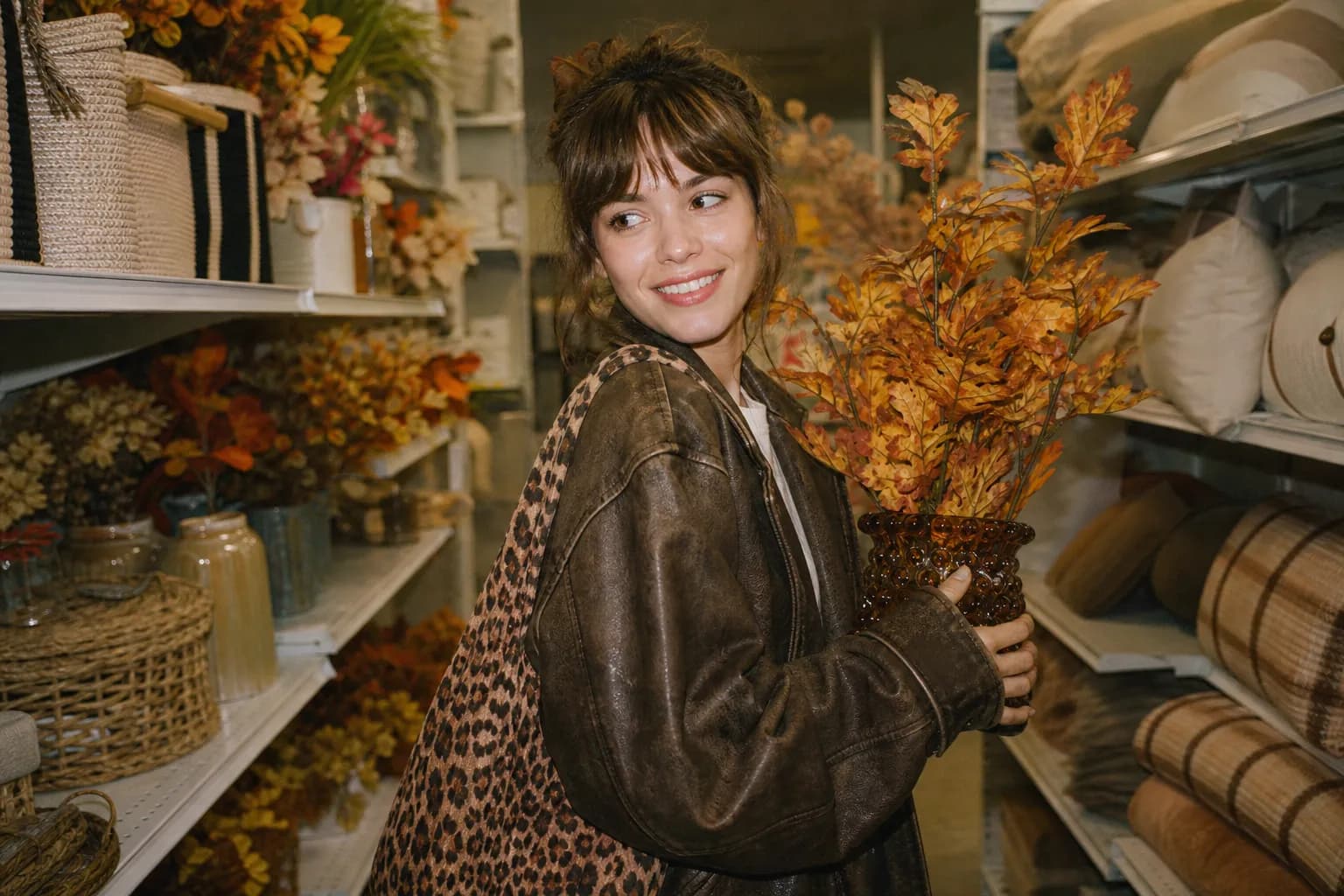 A retail aisle decorated with colorful seasonal displays and holiday merchandise