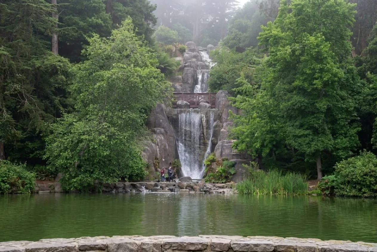 Foggy wide view of Huntington Falls at Stow Lake in Golden Gate Park