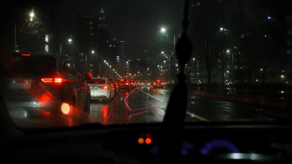 Night traffic seen through a windshield, representing Waze's live navigation strength