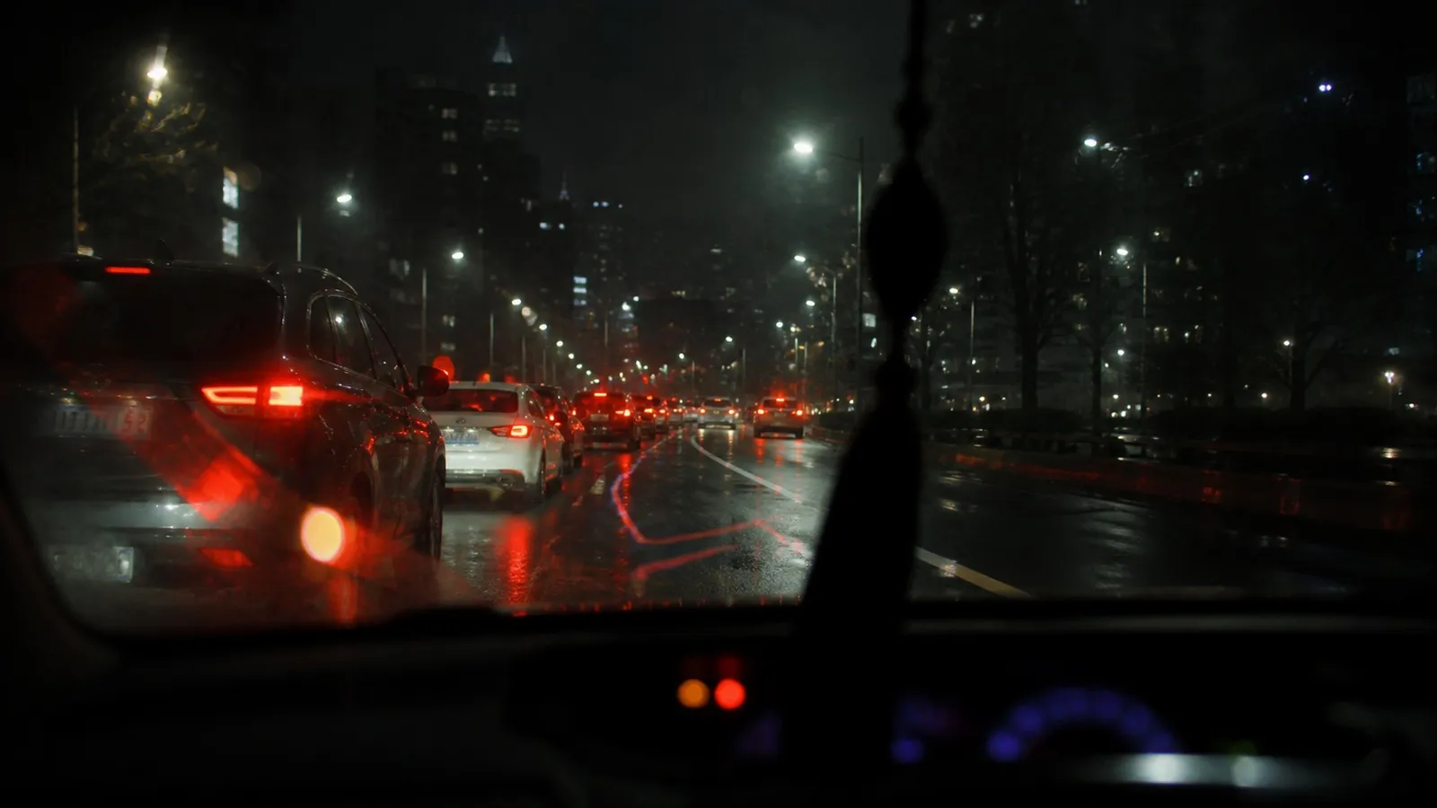 Night traffic seen through a windshield, representing Waze's live navigation strength