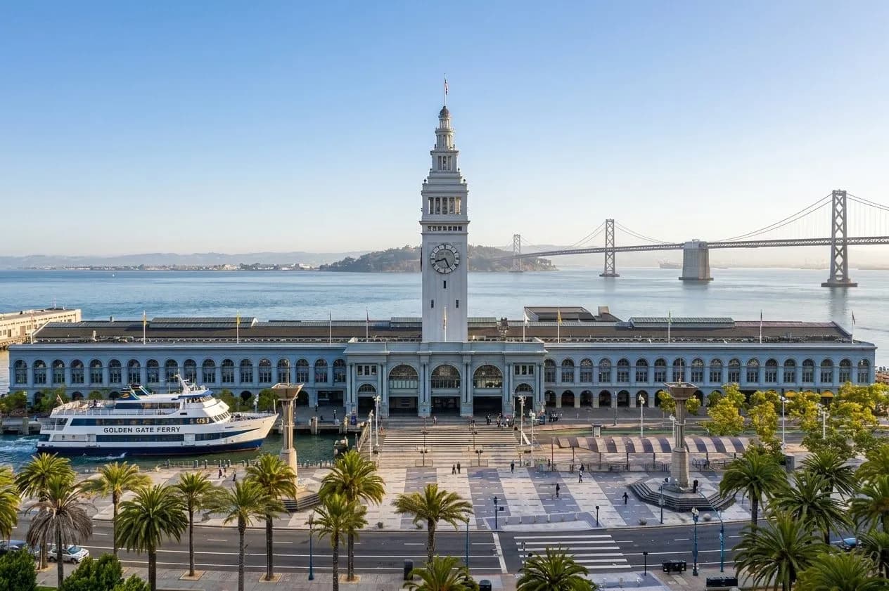 Golden Gate Ferry arriving at the San Francisco Ferry Building with bay light and weekend foot traffic