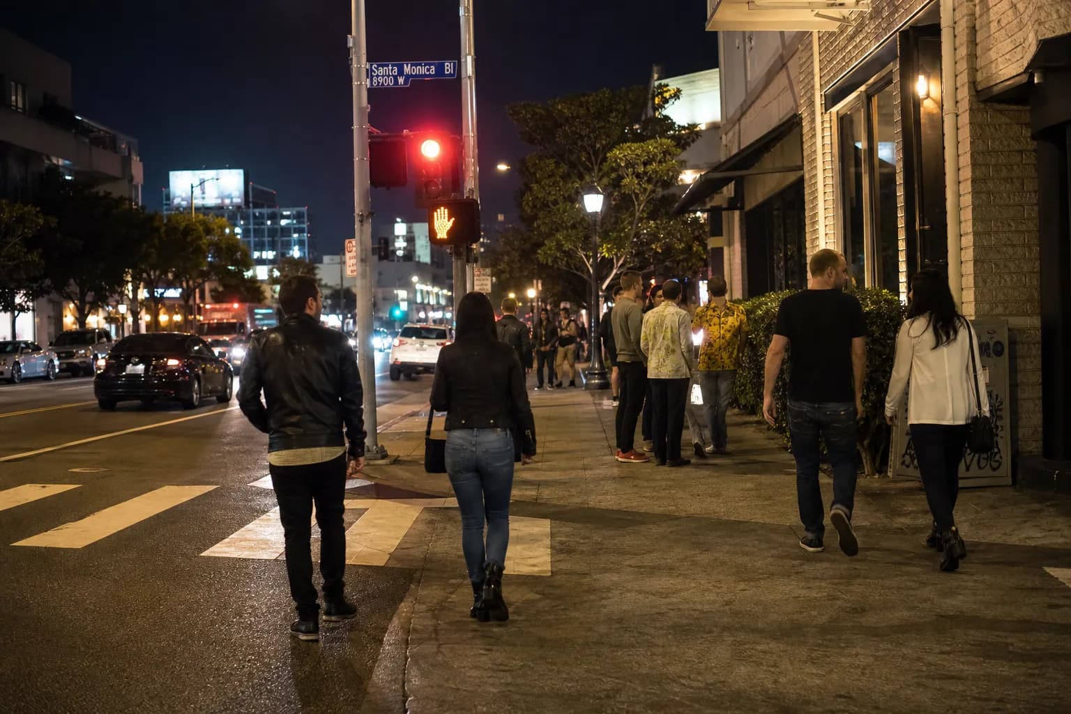 Late-night crowd and street scene in West Hollywood near Santa Monica Boulevard