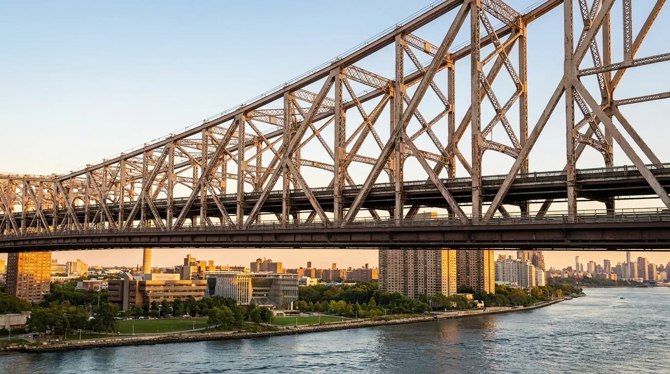 View of the Queensboro Bridge spanning the East River with Roosevelt Island visible beneath the bridge structure