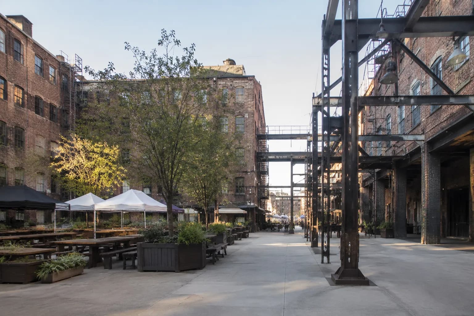 ROW DTLA courtyard in the Arts District with brick buildings and open plaza space on a Sunday morning