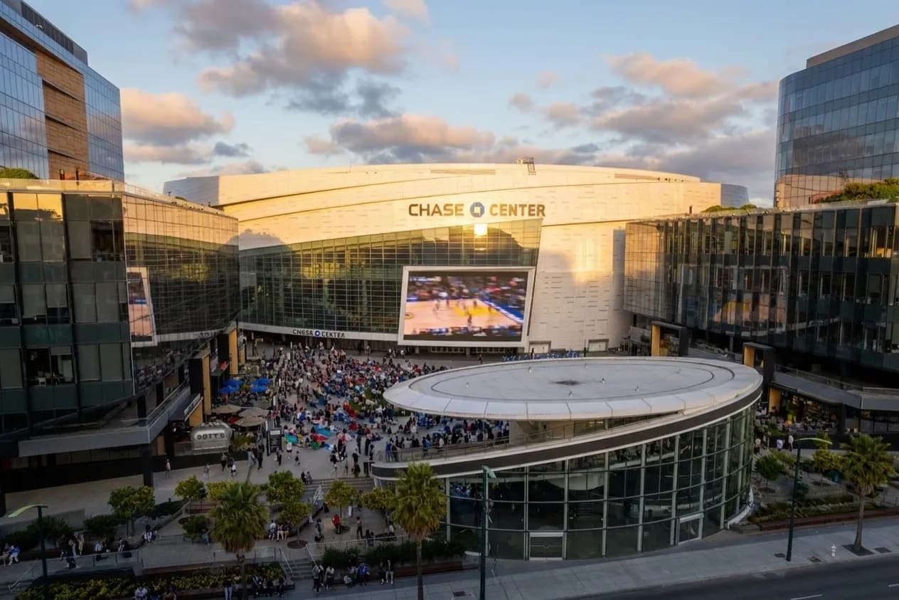 Wide view of Thrive City plaza at Chase Center with large LED screen and open gathering space in Mission Bay