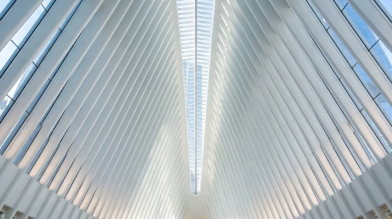 Interior architectural view of the Oculus World Trade Center transportation hub with vaulted white ribs