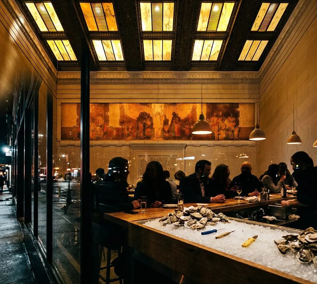 Window counter at Essex Pearl where the oyster shucker works facing Essex Street and shells pile on ice