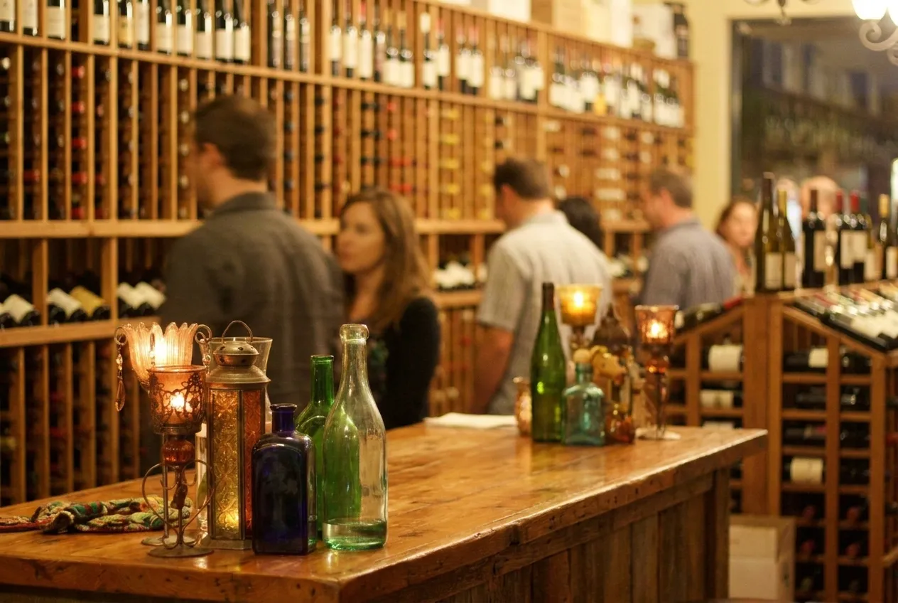 Interior of a Los Angeles bottle shop with wine racks and a small tasting bar