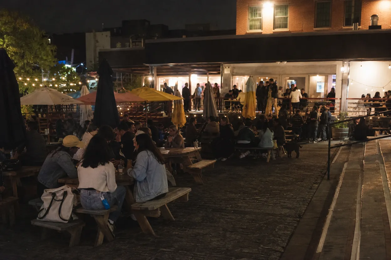 Cover scene for WNBA Double-Screen at Pig Beach Brooklyn: Big Tables for Split Loyalties