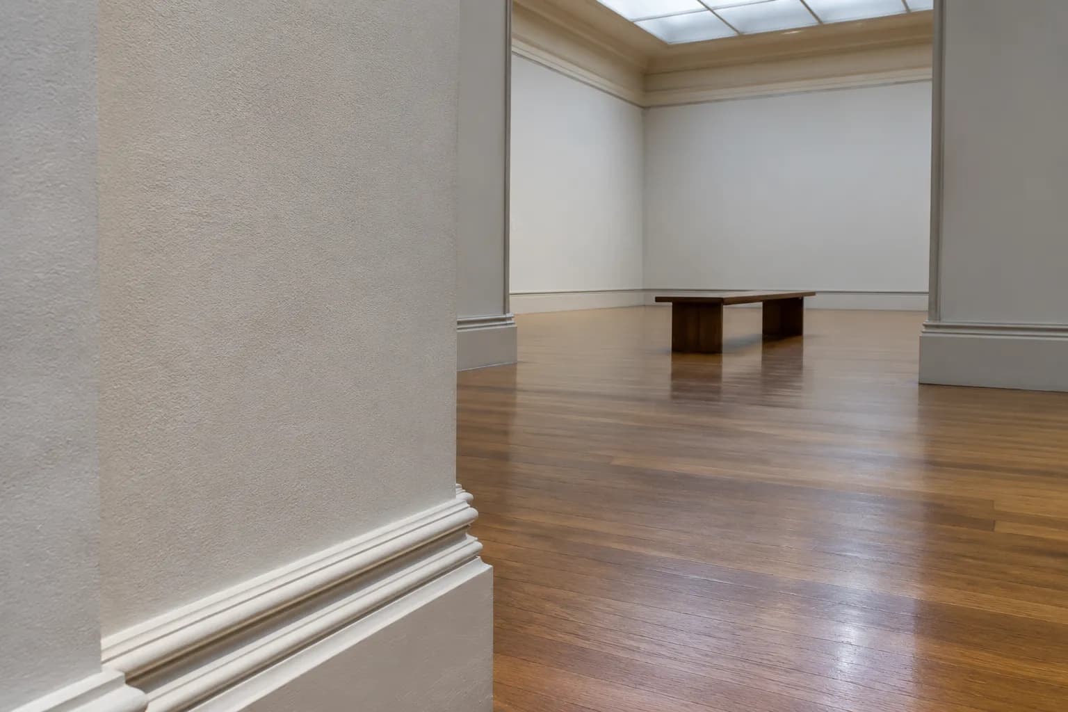 Empty contemporary gallery interior at Brooklyn Museum showing white walls and wood floor