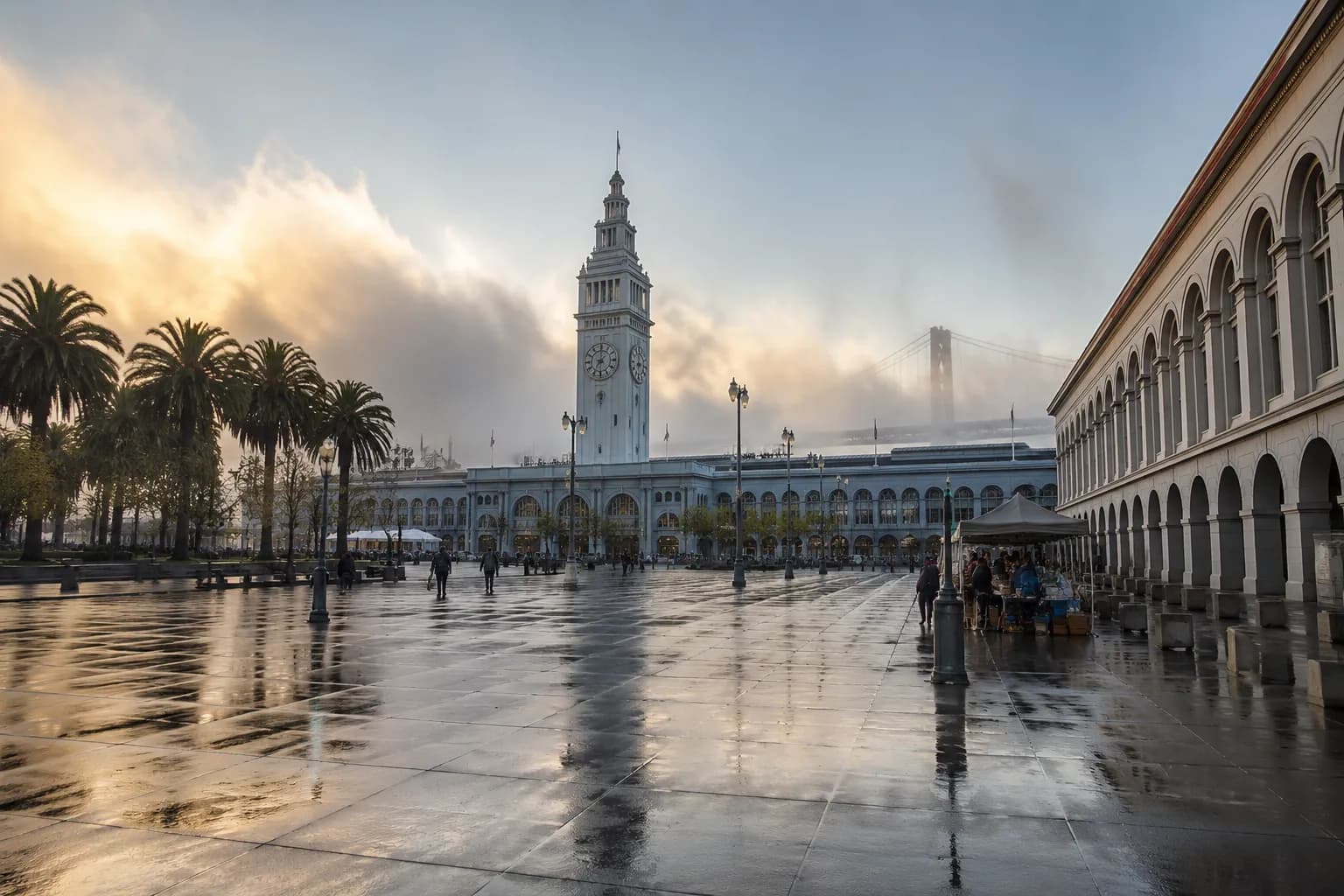 Embarcadero waterfront and Ferry Building clock tower on Saturday morning with clearing fog